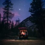 photo of vanlife couple under the stars with free camping