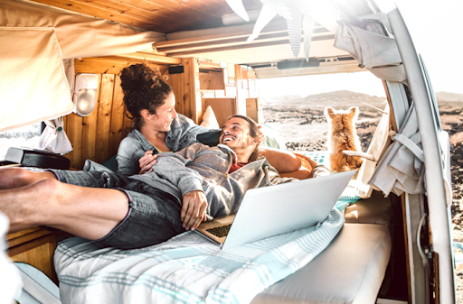 vanlife couple in bed