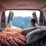 vanlifer looking at the back doors of a van