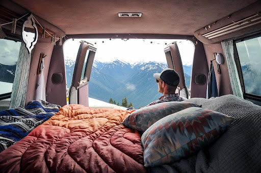 vanlifer looking at the back doors of a van