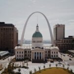 the saint louis arch looking over st louis city