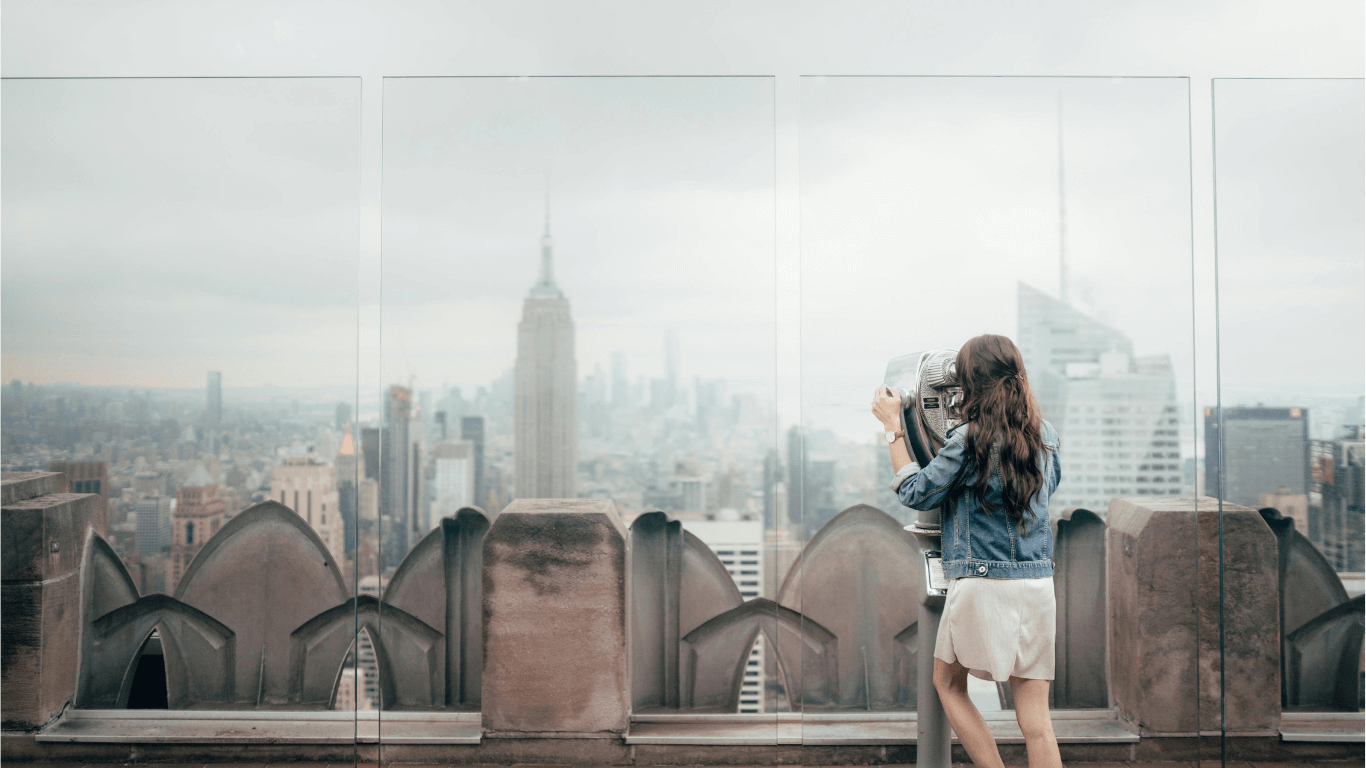 A Person looking at New York City from the Top of the Rock Observation Deck